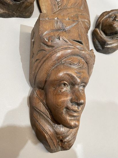 Three heads in high-relief carved natural...