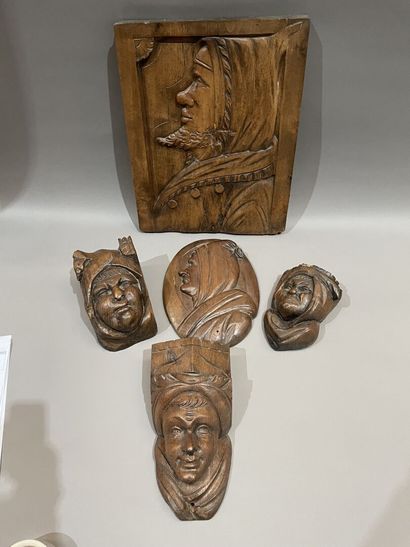 Three heads in high-relief carved natural...
