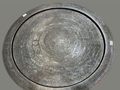 Round engraved brass top. 
Black wooden legs.
Maghreb,...