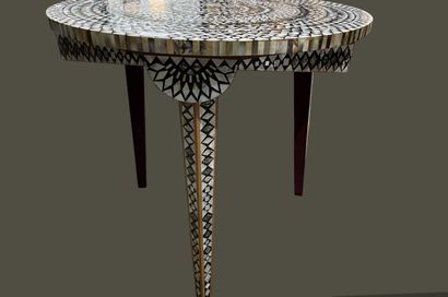 Two small tables: one round with three legs...