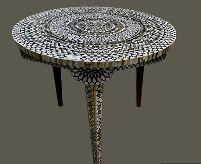 Two small tables: one round with three legs...