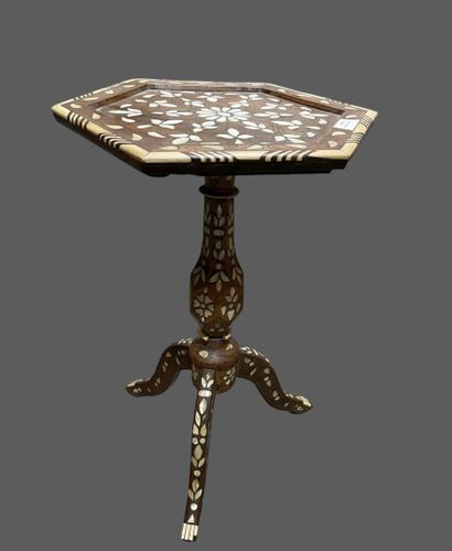 Two small tables: one round with three legs...