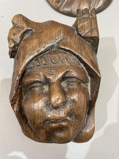 Three heads in high-relief carved natural...