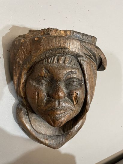 Three heads in high-relief carved natural...