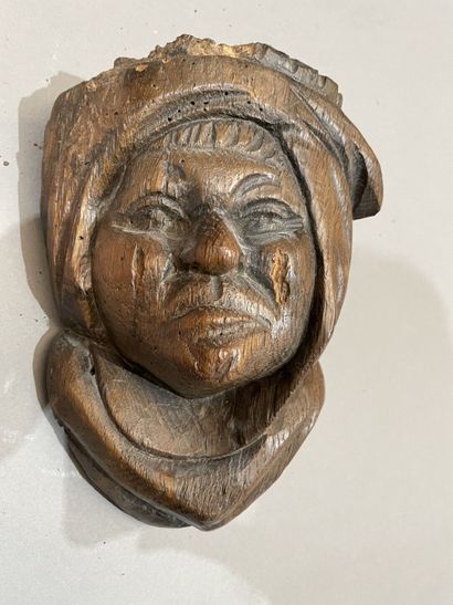 Three heads in high-relief carved natural...