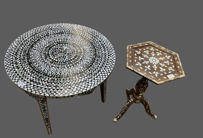 Two small tables: one round with three legs...