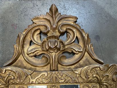 Small giltwood mirror carved with a flowery...