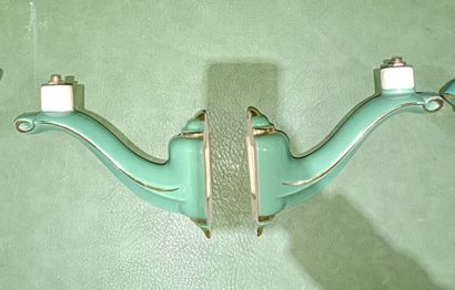 Set of four two-light green enameled earthenware...