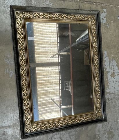 Blackened pearwood mirror with gilded fishnet...