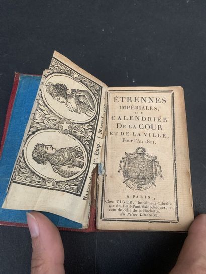 Small almanac bound in red morocco centered...