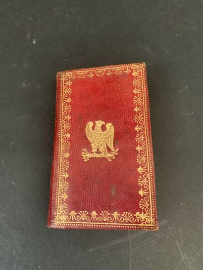 Small almanac bound in red morocco centered...