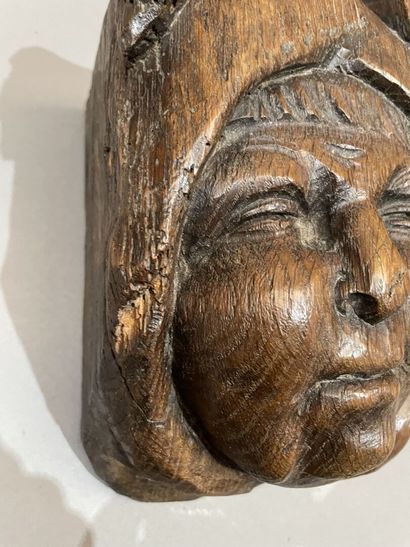 Three heads in high-relief carved natural...