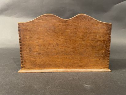 Wooden letter holder with four compartments.
24...