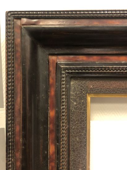 Wood frame with imitation tortoiseshell molding
Ext:...