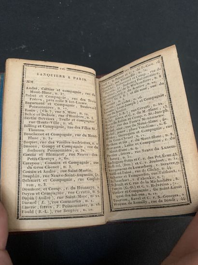 Small almanac bound in red morocco centered...