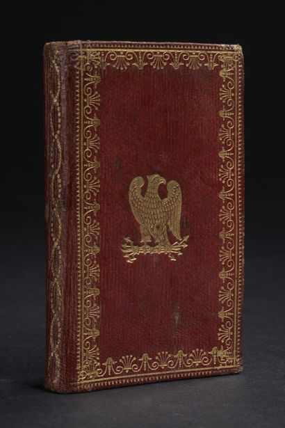 Small almanac bound in red morocco centered...