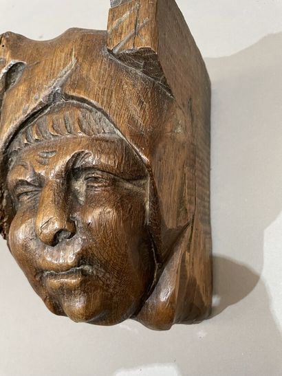 Three heads in high-relief carved natural...