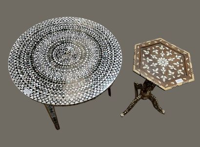 Two small tables: one round with three legs...