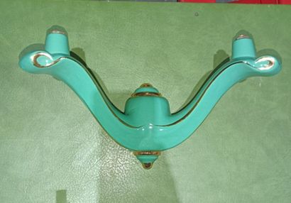 Set of four two-light green enameled earthenware...
