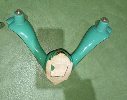 Set of four two-light green enameled earthenware...