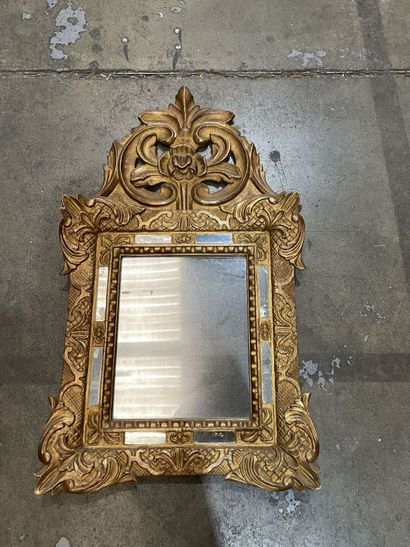 Small giltwood mirror carved with a flowery...