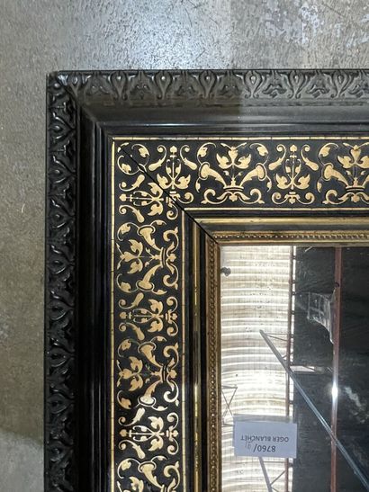 Blackened pearwood mirror with gilded fishnet...