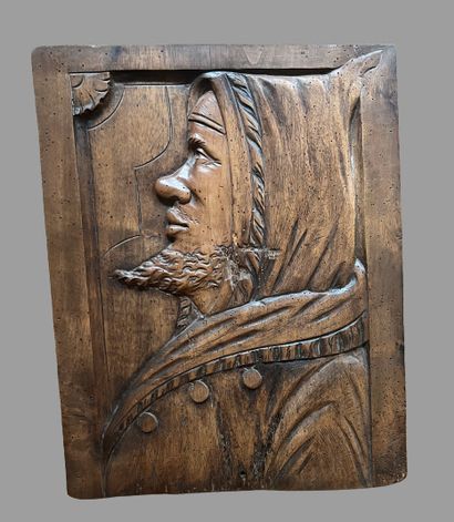 Three heads in high-relief carved natural...