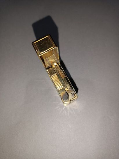 Set of three lighters, one of which is DUPONT,...