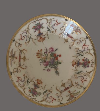 Service tête à tête en porcelaine à décor...