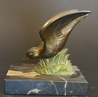 Serre-livres en bronze à patine doré et émaillé...