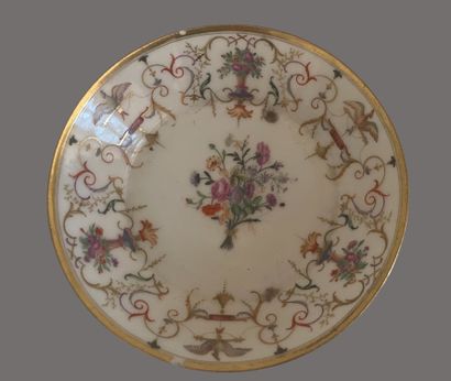 Service tête à tête en porcelaine à décor...