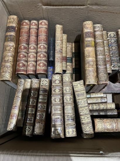 Bound and paperback books.
Eight boxes.
