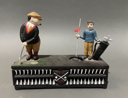 Groupe en fonte peinte, golfeur et son caddie
Travail...