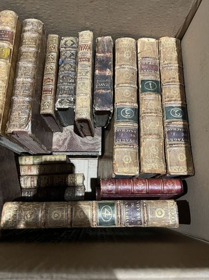 Bound and paperback books.
Eight boxes.