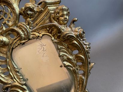 Gilt bronze table mirror with rocaille decoration.
19th...