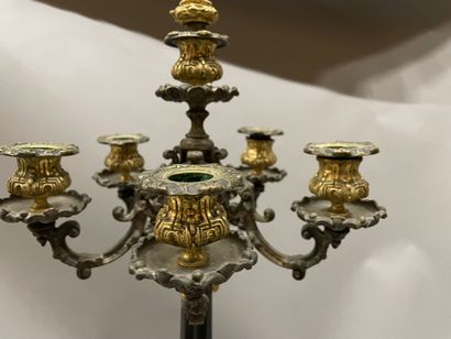 Pair of tripod candelabra in patinated and...