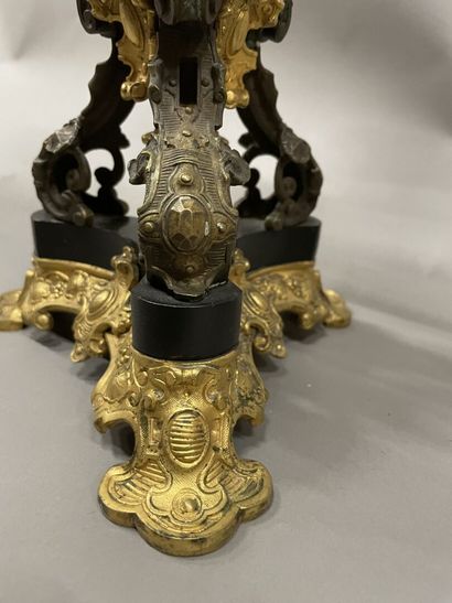 Pair of tripod candelabra in patinated and...