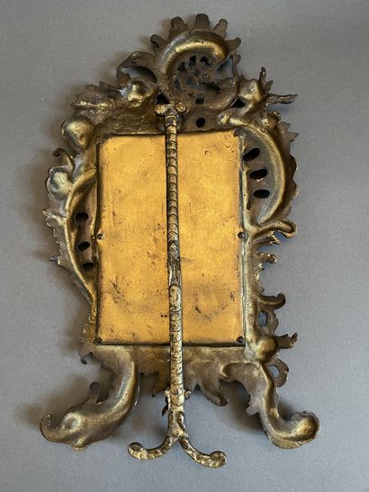 Gilt bronze table mirror with rocaille decoration.
19th...