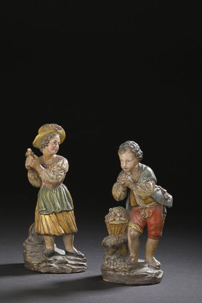Pair of terracotta statuettes painted au...