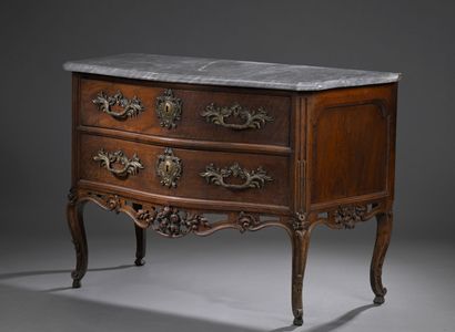 Moulded and carved walnut chest of drawers;...