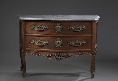 Moulded and carved walnut chest of drawers;...