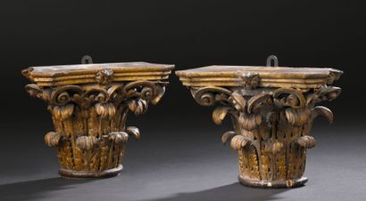 Pair of Corinthian capitals forming brackets...