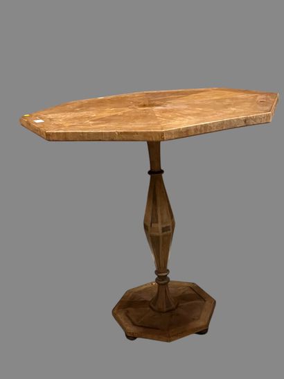 Octagonal pedestal table on canted shaft.
19th...