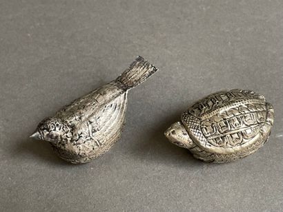 Two metal pill boxes in the shape of gourds
and...
