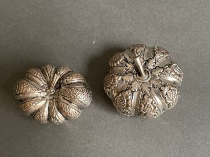 Two metal pill boxes in the shape of gourds
and...