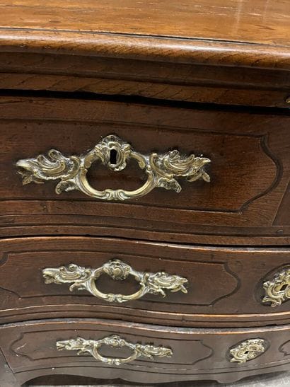 Chest of drawers in waxed oak with four molded...