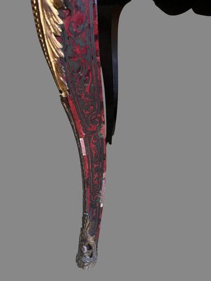 A Boulle-style red tortoiseshell veneered...