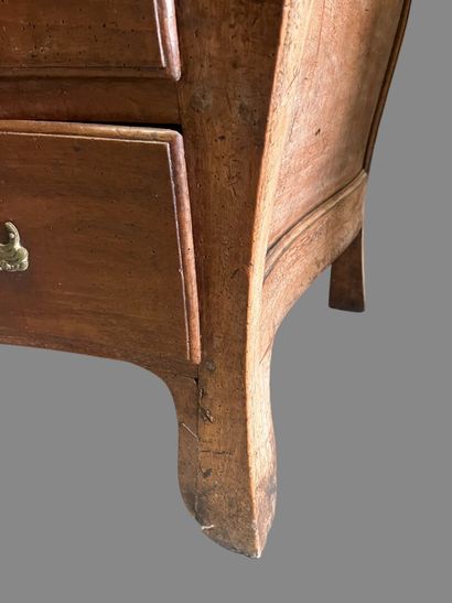 Natural wood chest of drawers with four drawers...