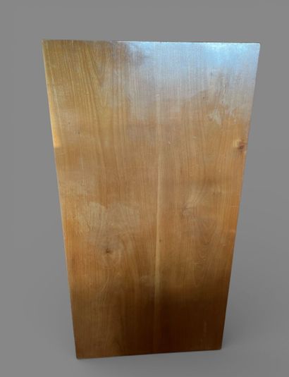 Rectangular dining room table in light wood...