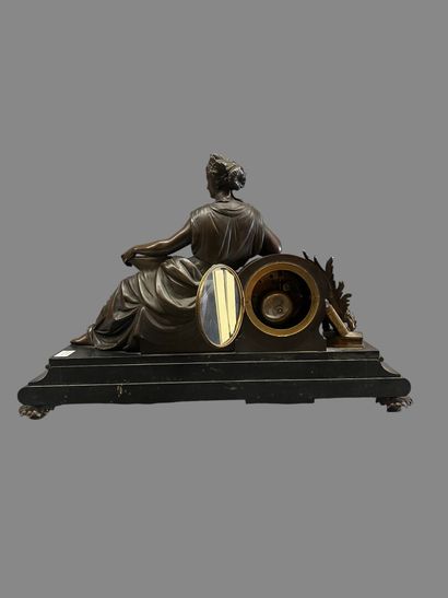 Bronze mantel clock with brown and gilded...